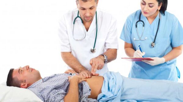doctors checking the patient's abdomen
