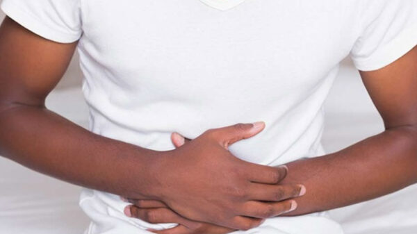 man hands on stomach